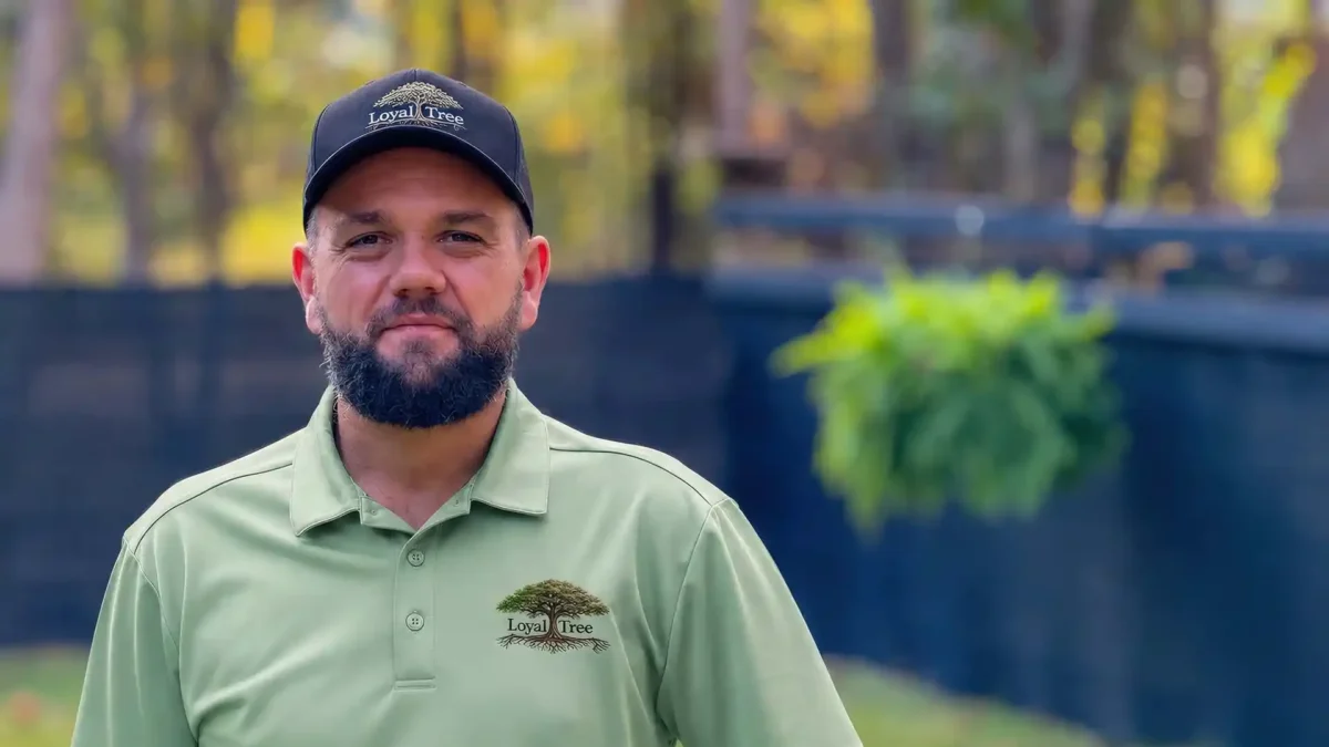LoyalTree owner and lead arborist Michael Williams in a company polo